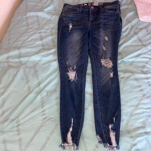 Dark blue ripped jeans and white ripped jeans